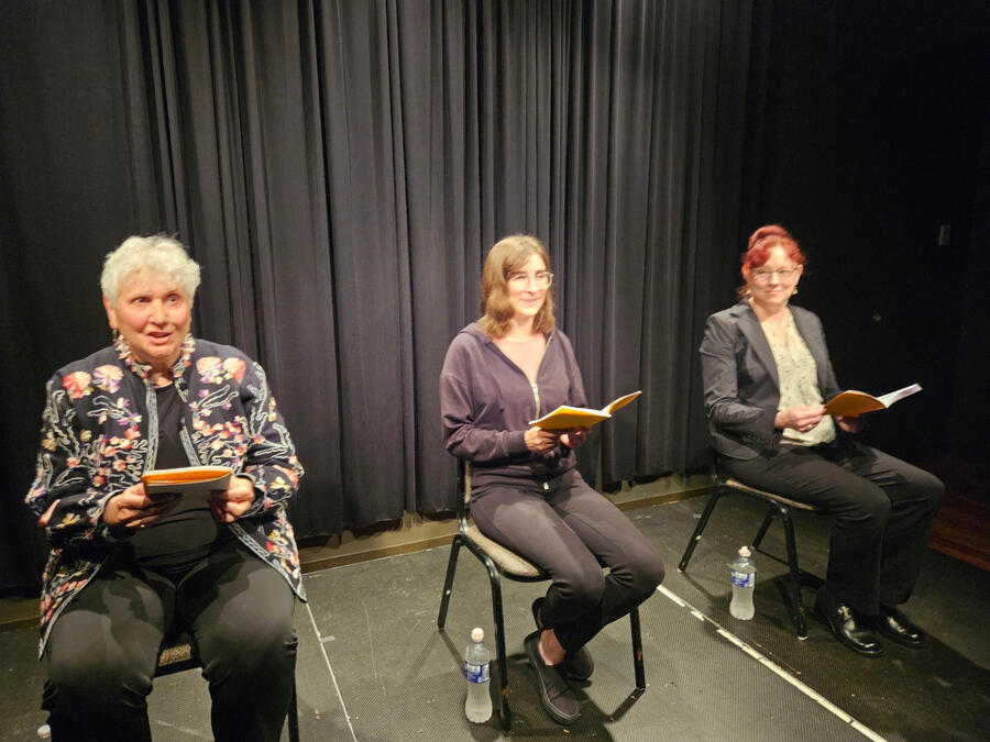 Onstage reading "Eleemosynary" with The Next Stage (May 2025)